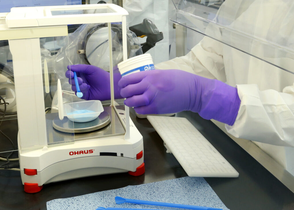 PCCA Training Laboratory worker analyzing a sample
