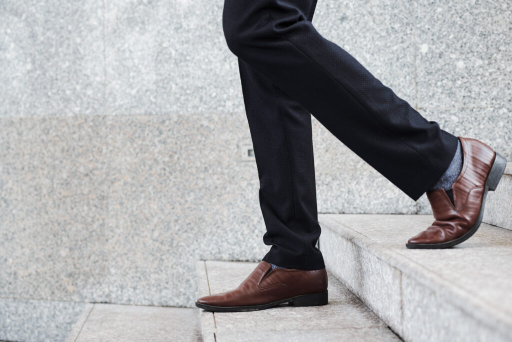 Businessman walking down the steps