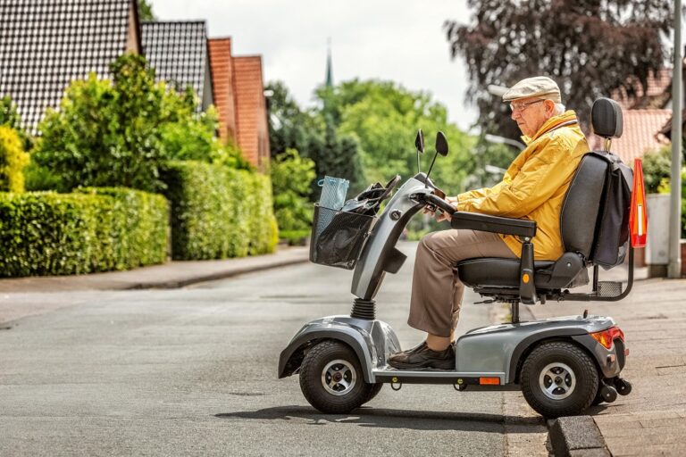 Old man driving a Scooter